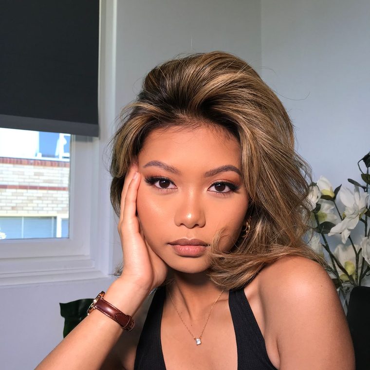 A photoshoot look: bronzed eyes and a full blow-out